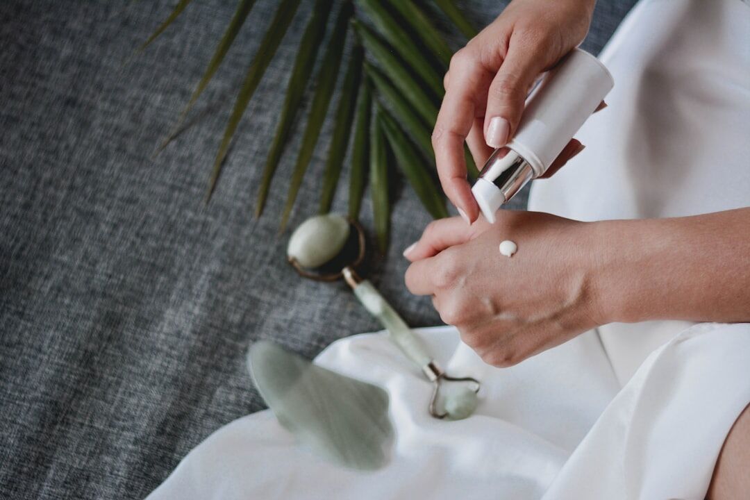 woman applying skincare
