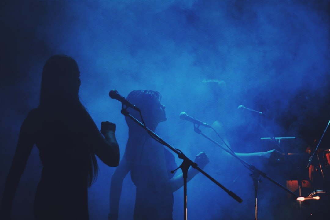 woman singing on stage