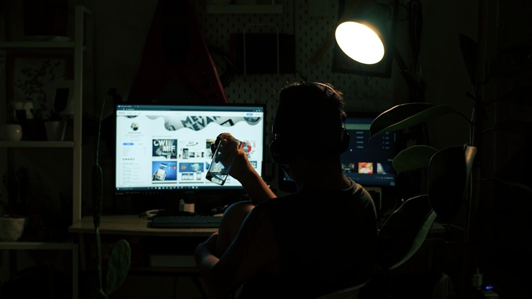 Editor working late at a desk with a keyboard and monitor