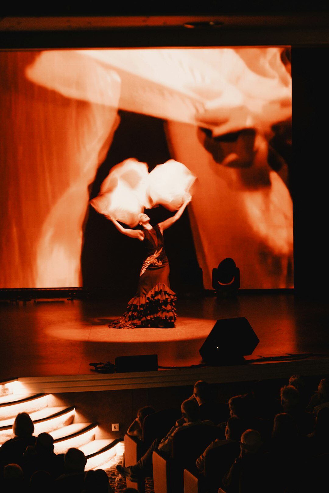 Golden trophy statues on a stage before an awards ceremony