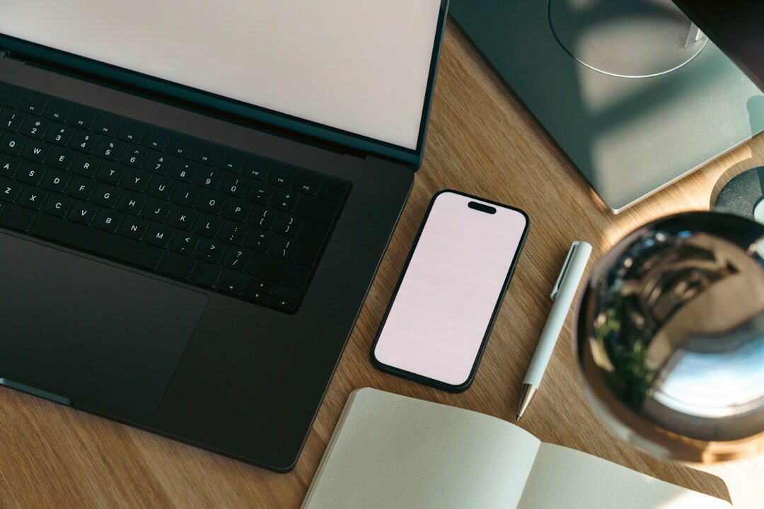 Notebook, phone and printed documents on a desk for research